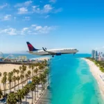 Commercial airplane operating los angeles to miami flights over the coast
